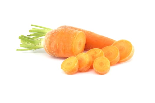 Whole carrot and sliced pieces, all with a bright orange color isolated on a white background