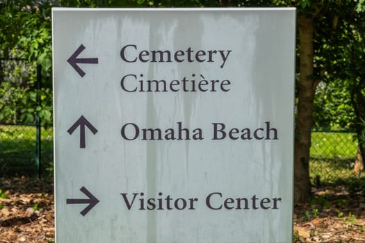 Directional sign at American cemetery at Normandy area. WWII memorial. High quality photo