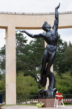 American cemetery staue Spirit of American Youth Rising from the Waves at Normandy area. WWII memorial. High quality photo