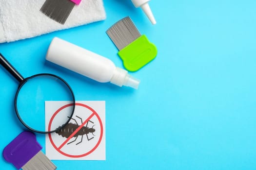 Anti lice equipment on blue background top view studio shot