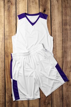 Basketball uniform on wooden background top view flat lay