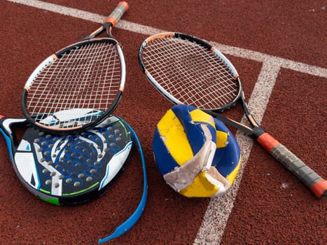 The broken rackets for playing tennis are hanging on the wall of a sports tennis club. . High quality photo