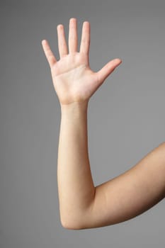 Woman Holding Arm Up in the Air with Gesture close up