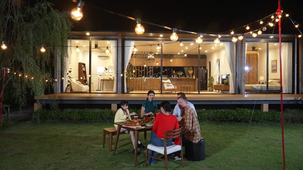 Family gather celebrate holiday. Parents, grandparents and girl together to talk and have dinner party food. Outdoor activity for spending time with multigeneration cross generation gap. Divergence.