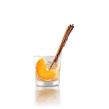 Spiced rum punch with orange slice and cinnamon stick splashing out of glass Food and. Food isolated on transparent background.