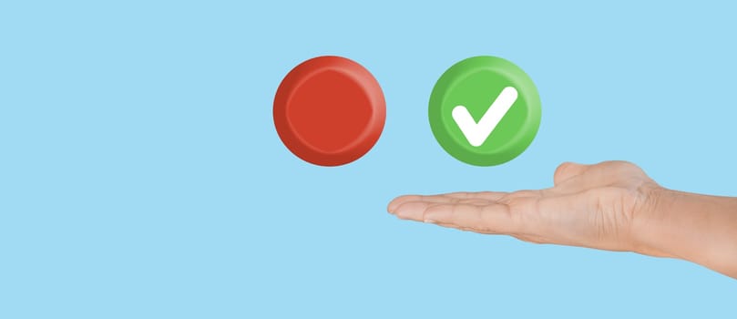 Hand hold green right sign icon and empty red icon on blue background. Choice concept.