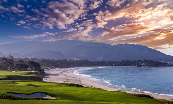 oceanside golf course with bunker,  ocean and clouds