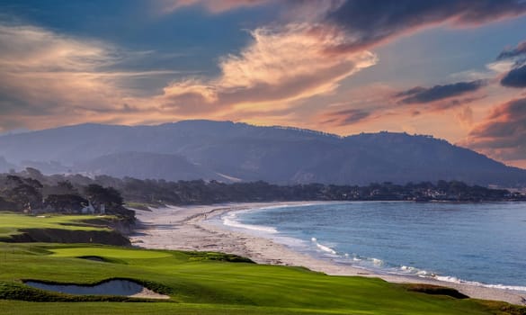 oceanside golf course with bunker,  ocean and clouds