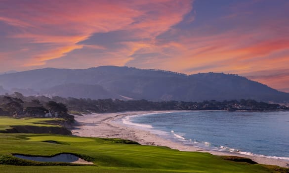 oceanside golf course with bunker,  ocean and clouds