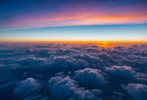 Horizon's Edge: Sunset Atop the Clouds in Azure Skies