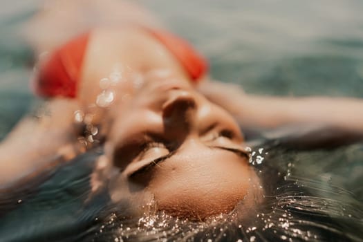 Happy woman sea relaxing floating in transparent sea water on summer holiday. Travel leisure recreation lifestyle, female in nature