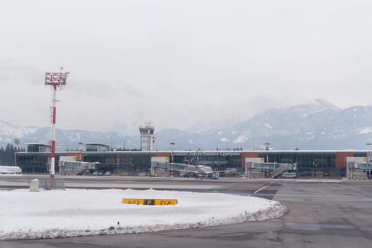 Brnik, Slovenia - February 13 2018: Passengers terminal at the Ljubljana Airport of Joze Pucnik in winter snow