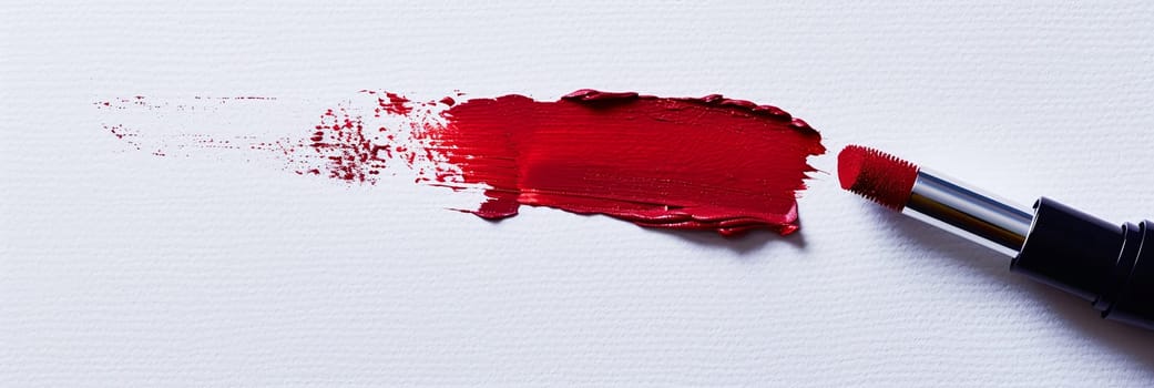 Red lipstick brush applies a vibrant matte shade, leaving a bold stroke on paper. Classic beauty in motion.