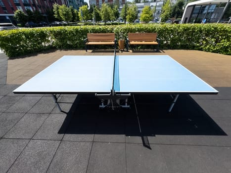 Concrete ping-pong table. Outdoor sports ground. Modern urban public space. High quality photo