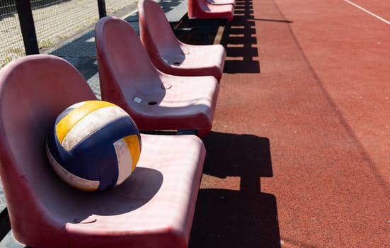 volleyball ball on bench on the sports tribune. High quality photo