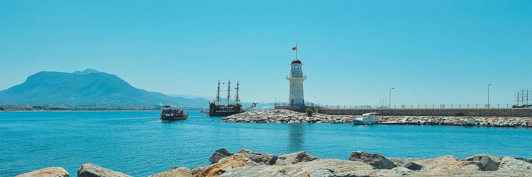 Banner of beautiful view of the sea, lighthouse and mountains. Alanya Turkey.soft focus.