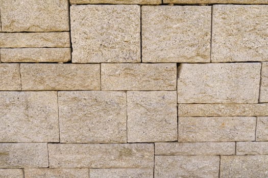 Detailed close-up of a stone wall showcasing its unique texture and abstract patterns.