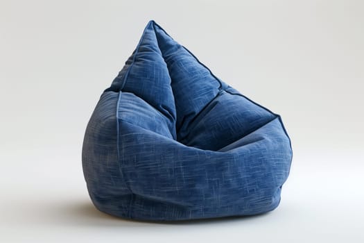 A blue bean bag chair sits atop a clean white floor, creating a simple yet modern seating arrangement.