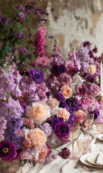 Floral arrangement of various flowers on the festive table. Selective focus