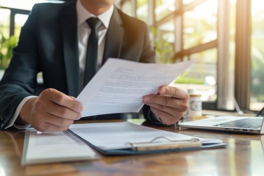 Businessman reviewing a contract, concept of legalities and formalities.