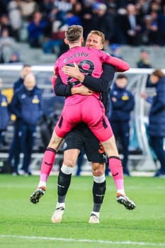 MELBOURNE, AUSTRALIA - MAY 22: Mark Gillespie and Dan Burn of Newcastle United celebrate after beating Tottenham Hotspur during the Global Football Week at The Melbourne Cricket Ground on May 22, 2024 in Melbourne, Australia