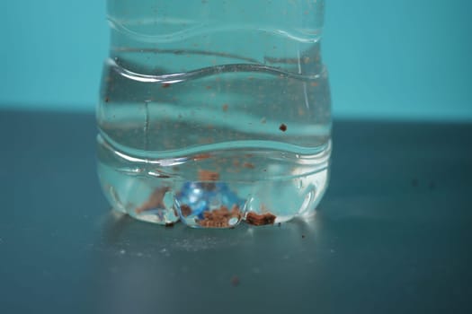 dirty bottle of water on a table ,