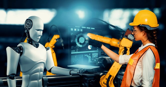 MLB Mechanized industry robot and human worker working together in future factory. Concept of artificial intelligence for industrial revolution and automation manufacturing process.