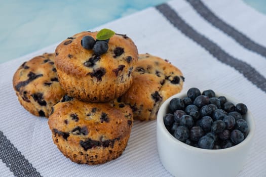 Homemade baked blueberry muffins with fresh blackberries. Tasty pastry sweet cupcake dessert. Berry pie Healthy vegan cupcakes with organic berries. Gluten free healthcare recipe from alternative flour