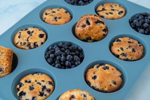 Fresh baked blueberry muffins. Tasty Sweet cupcake. Pastry homemade dessert. Berry pie in silicone muffin tin. Healthy vegan cupcakes with organic berries Baked in reusable silicon forms