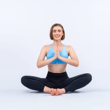 Full body length gaiety shot athletic and sporty woman doing healthy and meditative yoga exercise workout posture on isolated background. Healthy active and body care lifestyle