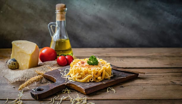 Copy Space image of Mac and cheese american macaroni pasta with cheesy Cheddar sauce with landscape view background.