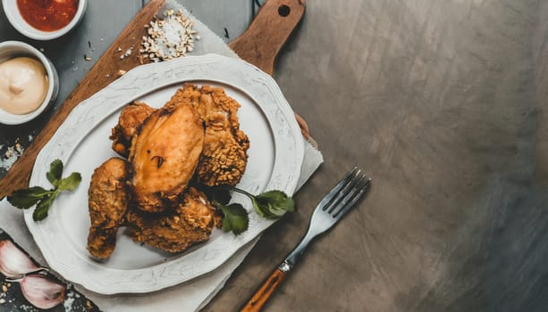 Copy Space image of crunchy Baked Chicken Tenders on a plate with tomato sauce, flat lay, free space