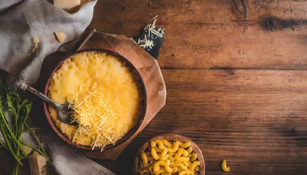 mac and cheese with corn, bacon topped with panko breadcrumbs on plate on dark wooden table