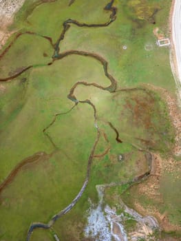 The meander in Antalya Sobucimen plateau. Aerial view of complex waterways weaving  through lush green fields