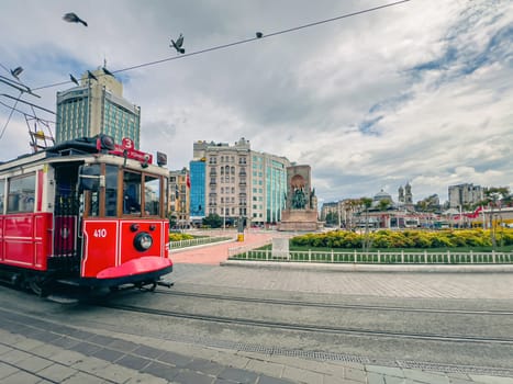 Ataturk statue and nostalgic tram in Taksim square in Istanbul