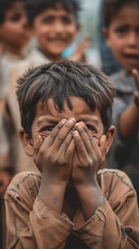 A young boy with his hands over his eyes stands out with a blurred background, engaged in a playful game. His peers await in anticipation, completing the scene