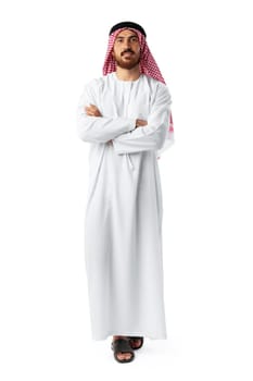 Smiling arab man while standing in an isolated white studio full length portrait