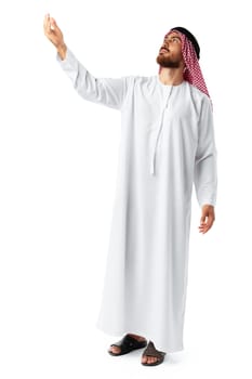 Young Arab man in traditional clothingpointing hand isolated on white background