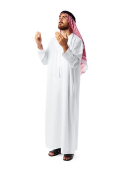 Young Arab man in traditional clothing praying isolated on white background