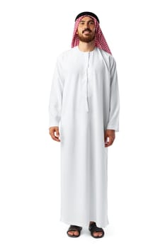 Smiling arab man while standing in an isolated white studio