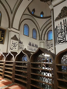 Ulukami, Great Mosque of Bursa in Turkey, open decorative wooden shoe shelves at the entrance to the mosque