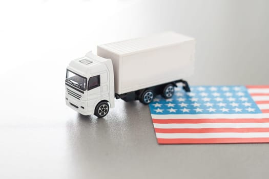 USA Logistics Concept. White Delivery Van on USA Flag background. 3d Rendering. High quality photo