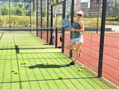 Woman players serving ball. Young adult girl play tennis outside arena. Person racket beat game club. People group hit sport court match. Fit care free time. Run skill train. Padel tennis team workout. High quality FullHD footage