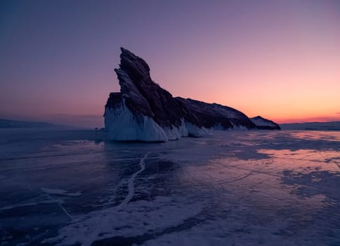 Ogoy island on winter Baikal lake. Winter scenery of Dragon Tail Rock on Ogoy island during sunrise at Lake Baikal.
