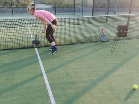 Tennis ball with net in sport club court . . High quality photo