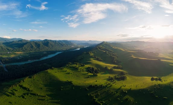 Aerial Panorama drone shot of beauty dawn on the peak, in the mountains in Altay, summertime