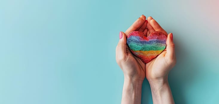 A person is holding a rainbow heart in their hand by AI generated image.