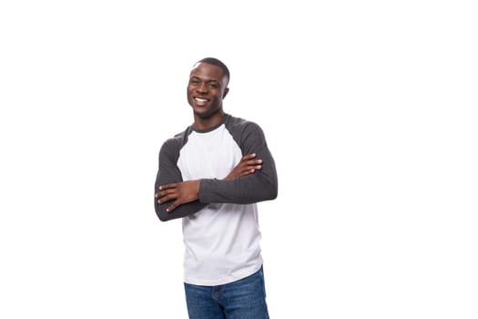 young american man dressed casual smiling broadly with teeth on white background.