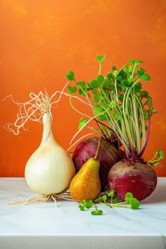 Variety of fresh vegetables displayed on table against orange wall