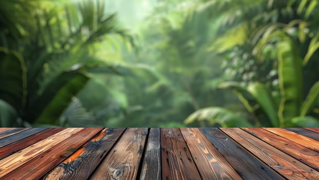 Empty wood table top with blur background of tropical jungle in summer green. The table giving copy space for placing advertising product on the table along with beautiful forest banner background.